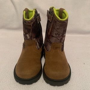 Magellan Outdoor kids’ boots. Size: 6D. Camouflage with lime green lining.